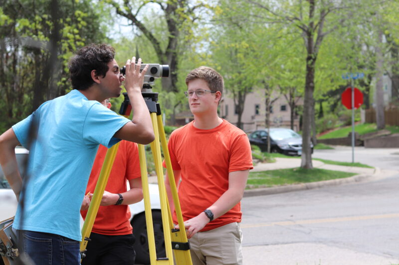 Students using the total station to check elevations - Land surveying